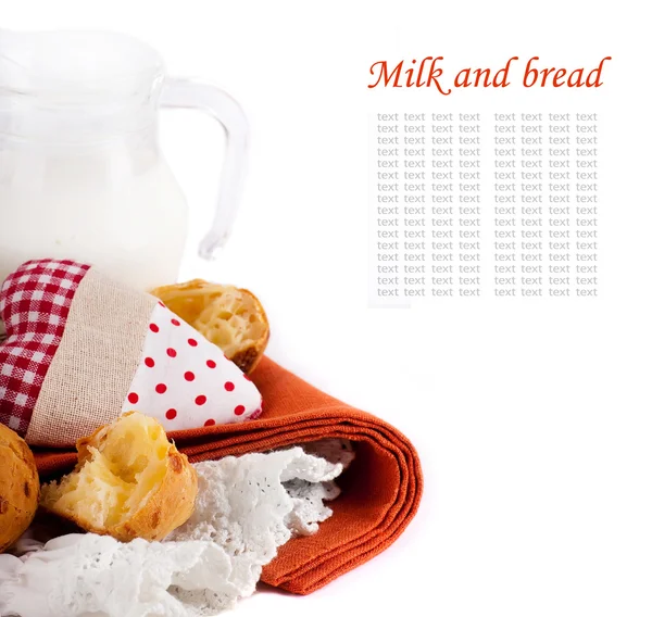 stock image Jug with milk, bread and red heart on a white background