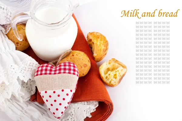 stock image Jug with milk, bread and red heart on a white background