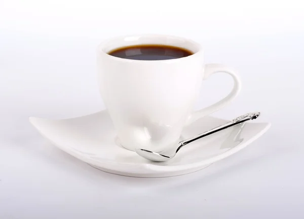 White cup of coffee with a silver spoon on a white background — Stock Photo, Image