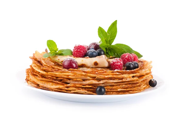 Pancakes with berries and mint on a white background — Stock Photo, Image