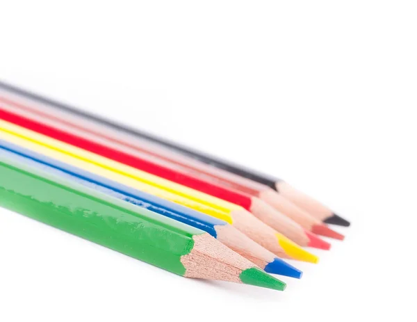 Kurşun kalem, boya ve beyaz bir arka planda fırçalar — Stok fotoğraf