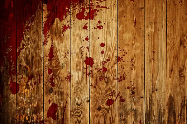 Spruzzi di vernice rossa su tavola di legno — Foto Stock