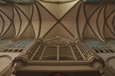 Old organ under a cross vault clipart