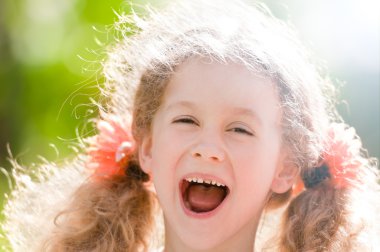 Beautiful little girl laughing clipart