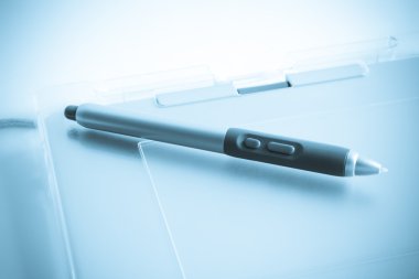 Graphic tablet with pen clipart