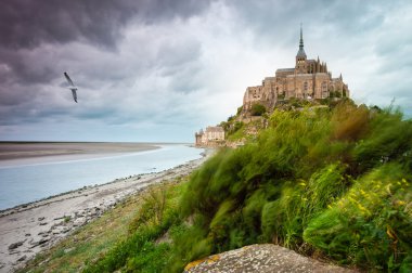 Mont Saint-Michel at windy stormy day clipart