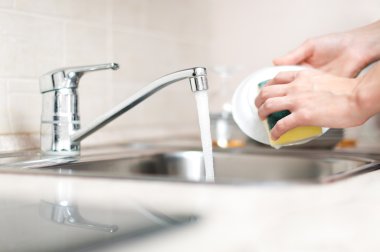 Woman washing dishes clipart