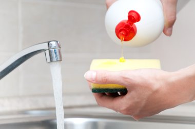 Woman washing dishes clipart