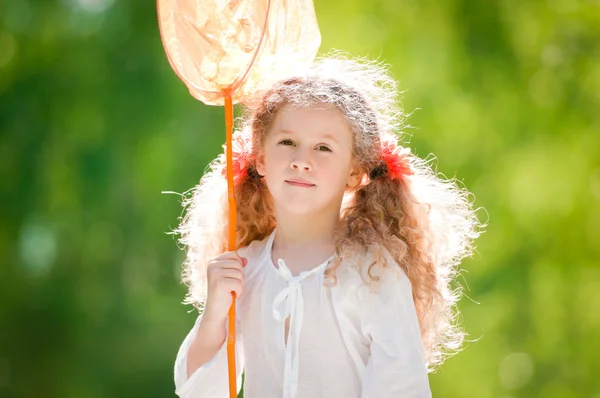 Beautiful little girl with butterfly net — Stock Photo, Image