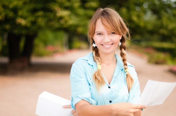 Beautiful young student girl with letter — Stock Photo, Image