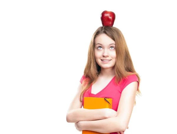 Estudante menina com maçã na cabeça — Fotografia de Stock
