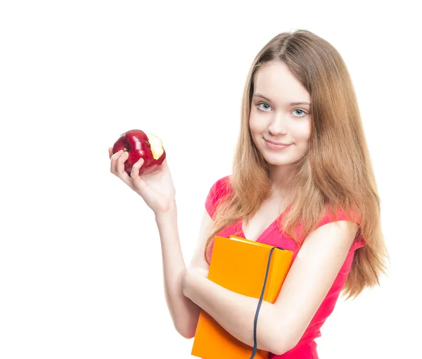 Schülerin isst Apfel. — Stockfoto
