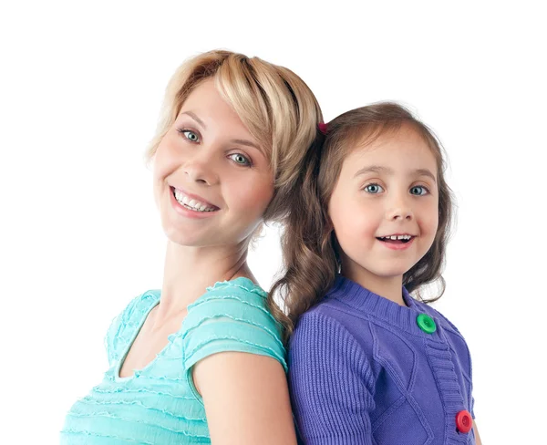 Happy mother and daughter smiling in studio — Stock Photo, Image