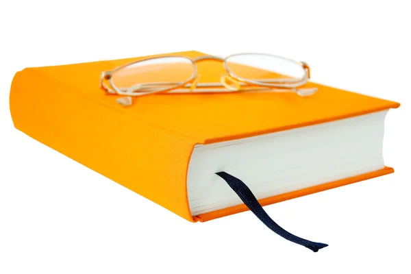 Книга с очками — стоковое фото
