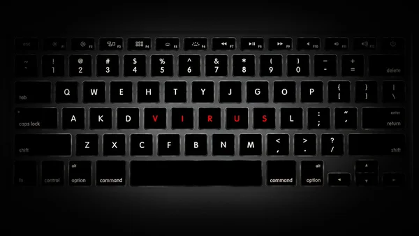 Teclado do computador e vírus palavra feita de chaves . — Fotografia de Stock