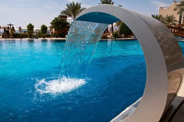Fountain at hotel pool — Stock Photo, Image
