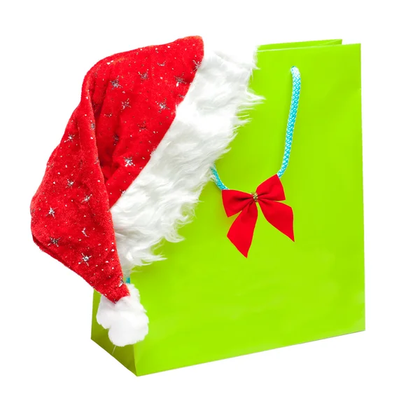 Noel Baba şapkası olan yeşil paket — Stok fotoğraf