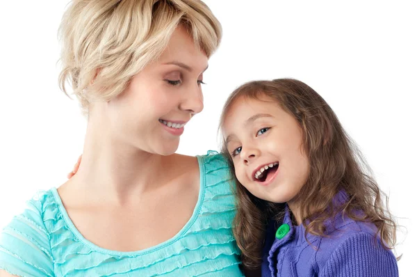 Mutter lächelt und Tochter lacht lizenzfreie Stockbilder