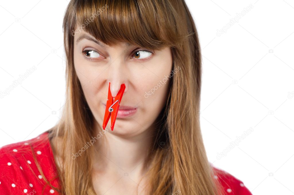 Girl with clothespin on her nose