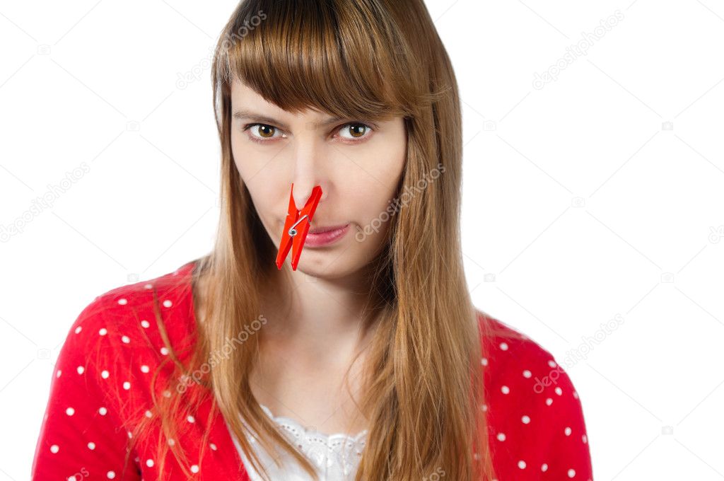 Girl with clothespin on her nose