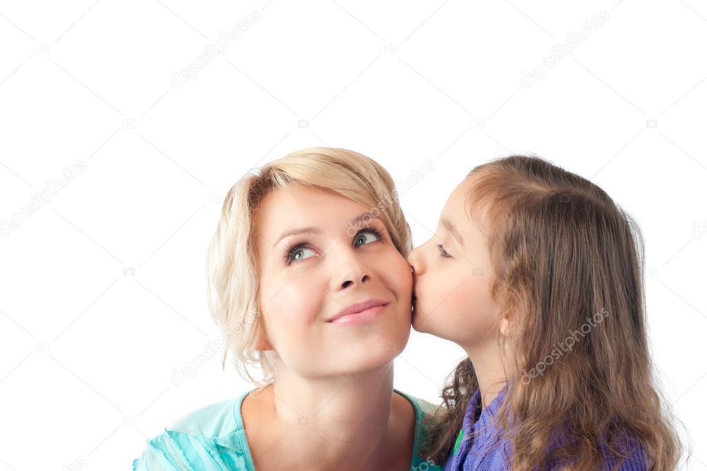 Little daughter kissing young mother