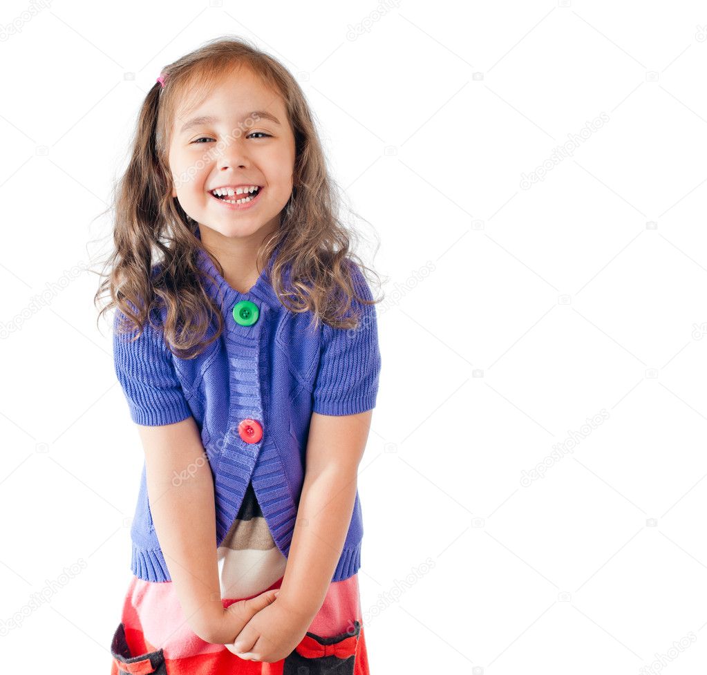 Little girl laughing and looking into the camera
