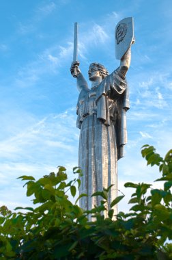 Motherland monument against cloudy blue sky clipart
