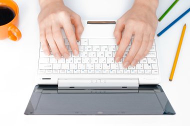 Hands typing on computer clipart