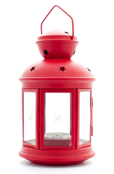 Красный фонарь со свечой внутри — стоковое фото