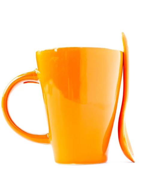 Copo laranja e colher — Fotografia de Stock