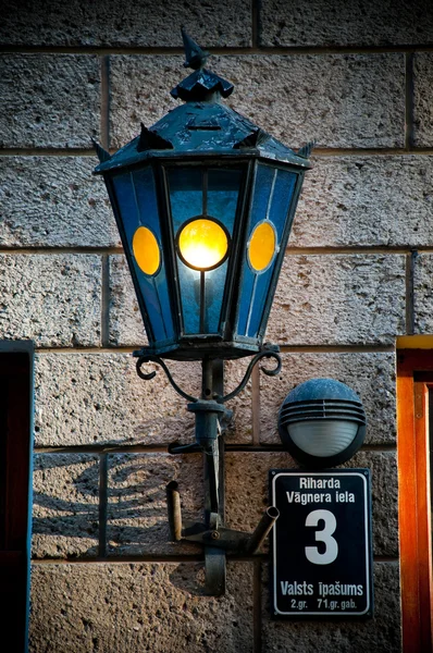 Old lantern on old wall — Stock Photo, Image