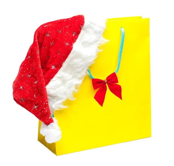 Noel Baba şapkası olan sarı paket — Stok fotoğraf