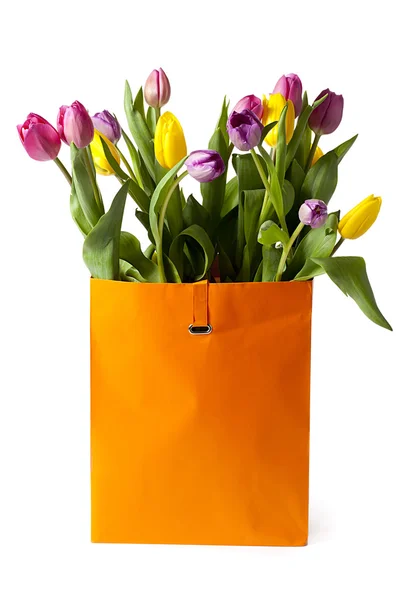 Fresh tulips in paper bag — Stock Photo, Image