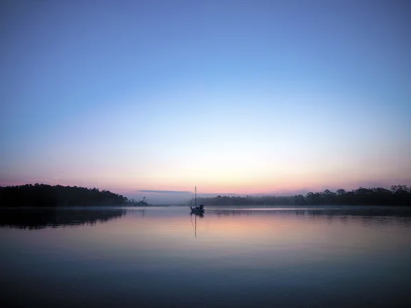 Sunset with sailboat — Stock Photo, Image