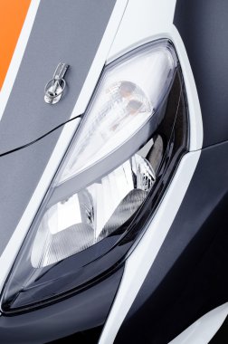 Headlight of a sport car clipart