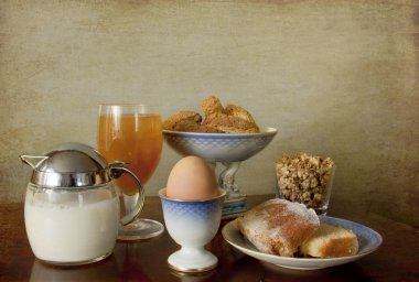 Continental breakfast: pastry,cookies,boiled egg,juice,muesli clipart