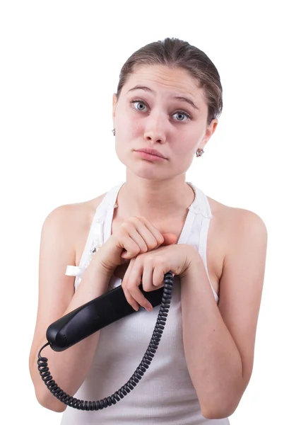 Porträtt av en ung vacker kvinna som talar på en telefon — Stockfoto