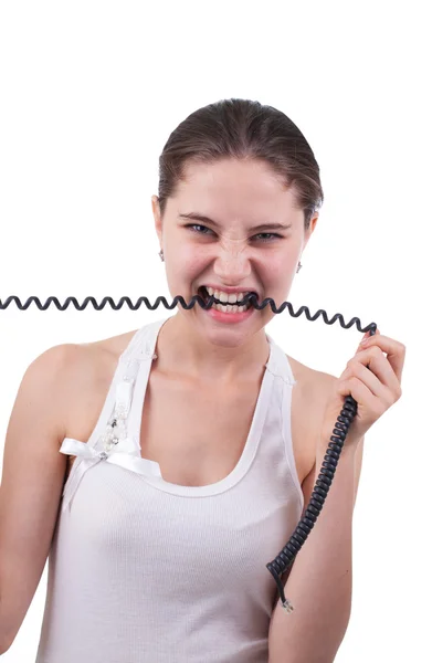 The girl bites the telephone wire — Stock Photo, Image
