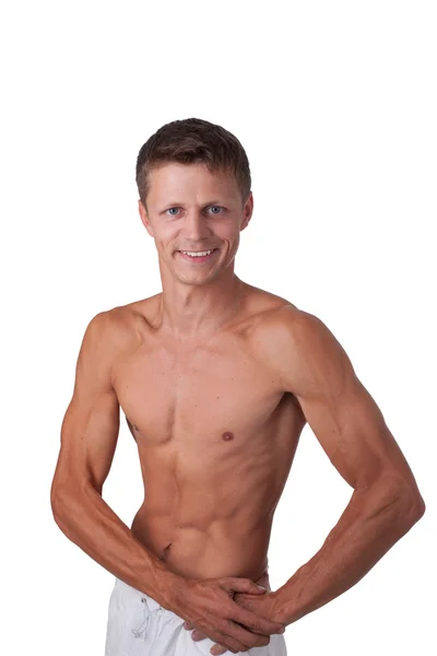 Усміхнений чоловік показує м'язи ізольовані на білому — стокове фото