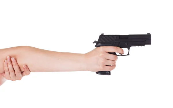 Woman's hand holding a gun — Stock Photo, Image