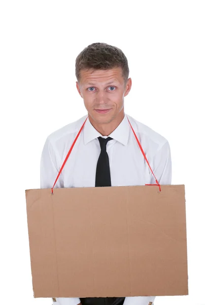 Businessman with an empty cardboard sign on his chest — Stock Photo, Image