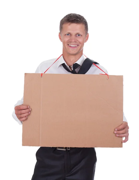 stock image Businessman holding a board