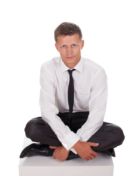 Affärsman i meditation ställning — Stockfoto