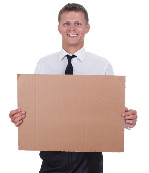 Attractive man in business suit with blank sign — Stock Photo, Image