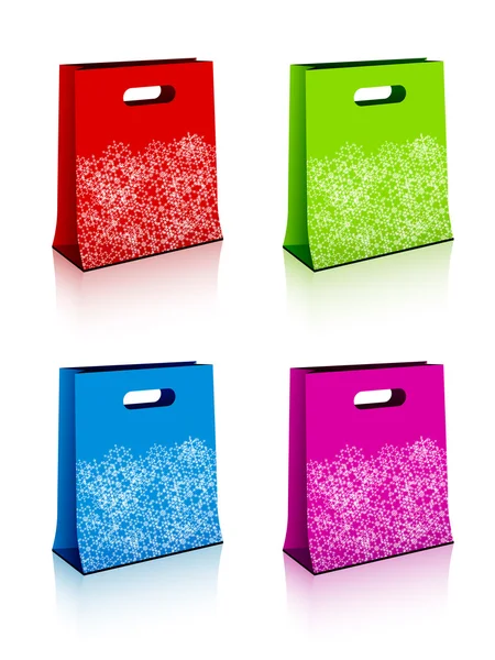Paper shopping bags with christmas snowflakes — Stock Vector