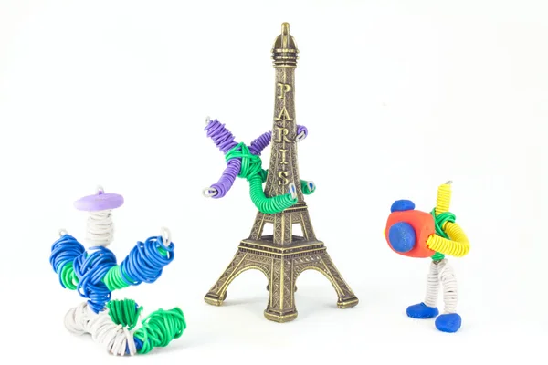 Eiffel Tower with toys playing around — Stock Photo, Image