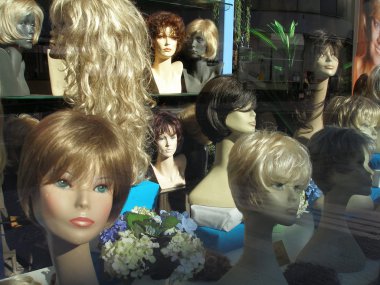 Wigs in a show window clipart