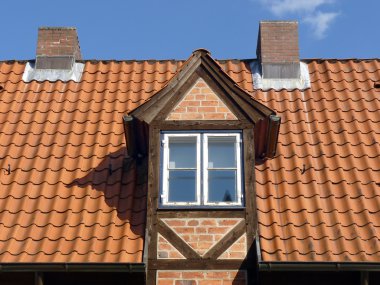 Dormer on an old roof clipart