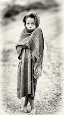 An Ethiopian boy wears the old blanket and poses for the camera clipart