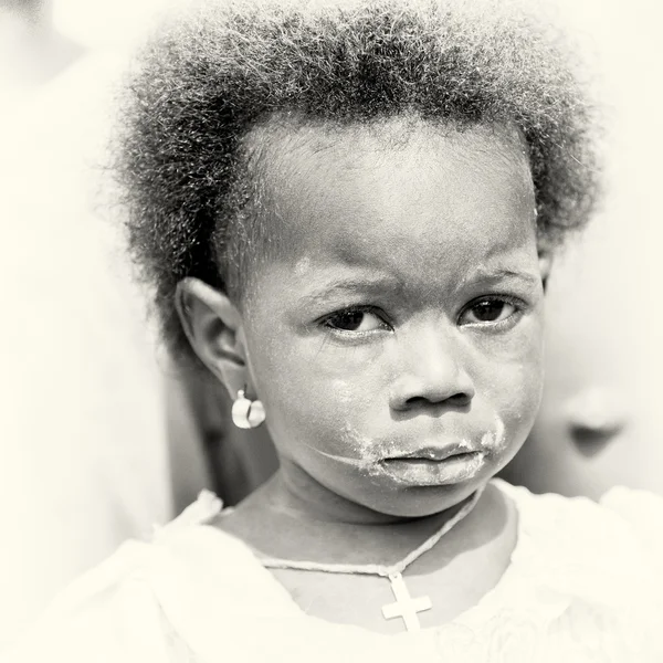 Little Ghanaian girl with sad eyes — Stock Photo, Image
